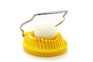 Image showing Boiled egg in the egg slicer.