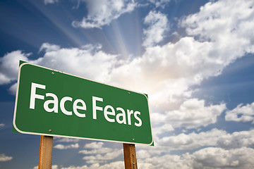 Image showing Face Fears Green Road Sign and Clouds