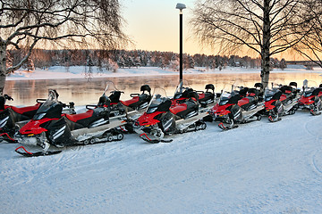 Image showing Vehicles are a number of snowmobiles