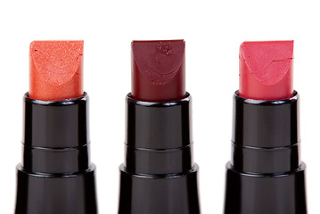 Image showing Three lipstick set in a row