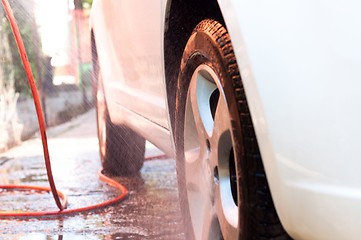 Image showing Washing a car