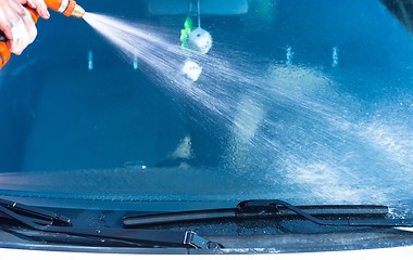 Image showing Washing a car