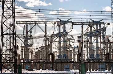 Image showing Electric pylons against blue sky