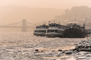 Image showing Frozen boats on the river