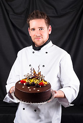 Image showing Handsome chef with cake