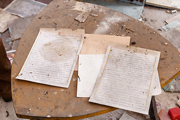 Image showing Old documents on dirty table