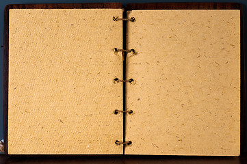 Image showing Opened book agains dark board