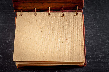 Image showing Empty notebook on black background