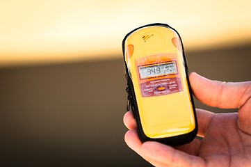 Image showing Geiger counter in hand