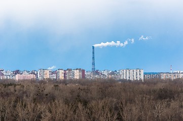 Image showing Big chimney in the middle of a city