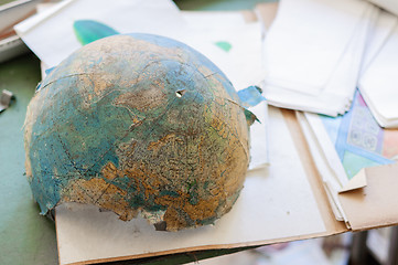 Image showing Abandoned and broken globe in a school 