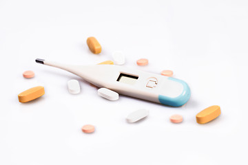 Image showing Thermometer and pills isolated on white