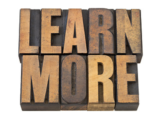 Image showing learn more text in wood type