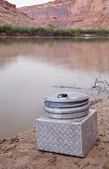 Image showing portable toilet on a shore of southwestern river