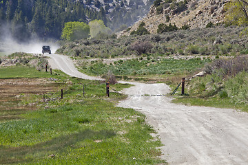Image showing dusty road in a mountain canyon