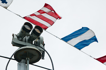 Image showing The ship field-glass and alarm flags