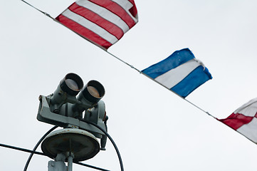 Image showing The ship field-glass and alarm flags