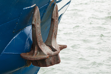 Image showing Old rusty anchor at a board of the ship