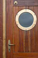 Image showing Old ship door with a window