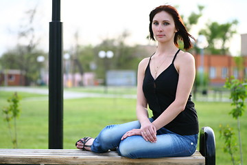 Image showing girl is posing against park