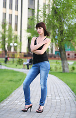 Image showing girl is posing against park