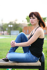 Image showing girl is posing against park