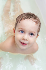 Image showing Baby taking bath and swim on chest