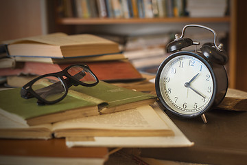 Image showing books with clock