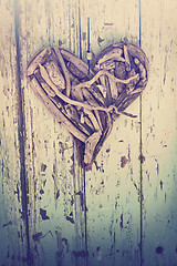 Image showing driftwood heart on vintage wall