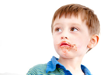 Image showing Toddler eating chocolate