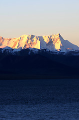 Image showing Landscape of snow-capped mountains at lakeside