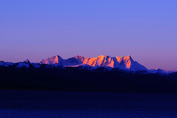 Image showing Landscape of snow-capped mountains at lakeside