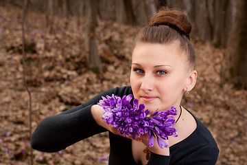 Image showing girl with snowdrops