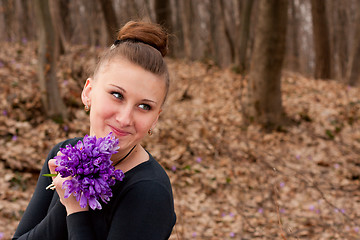 Image showing girl with snowdrops