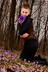 Image showing girl with snowdrops