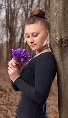 Image showing girl with snowdrops