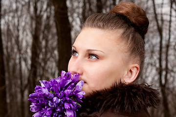 Image showing girl with snowdrops