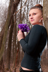 Image showing girl with snowdrops