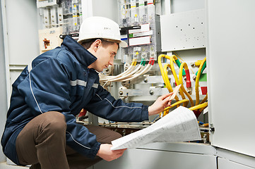 Image showing Electrician checking cabling power line