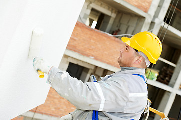 Image showing builder facade painter at work