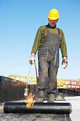 Image showing Flat roof covering works with roofing felt