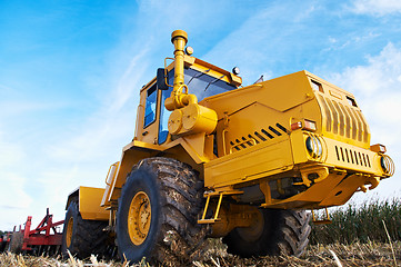 Image showing Ploughing tractor at field cultivation work