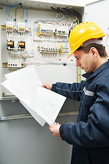 Image showing Electrician checking cabling power line