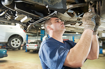 Image showing auto mechanic at car suspension repair work