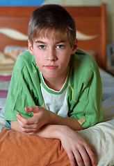 Image showing calm boy  alone in bed