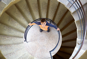 Image showing young boy with mother on staircase