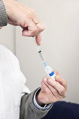 Image showing Doctor Filling Syringe For Vaccination