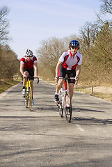 Image showing Climbing cyclists