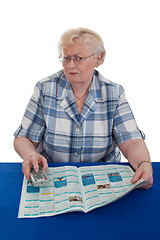 Image showing Senior woman watching TV