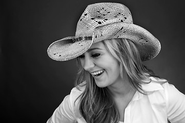 Image showing Beautiful Cowgirl laughing